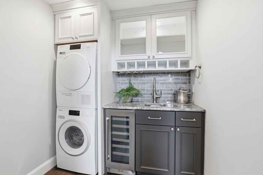83 Church Street, Unit 15 Winchester, MA 01890 - Photo 15 of 34 a close view of a utility room with sink and a window