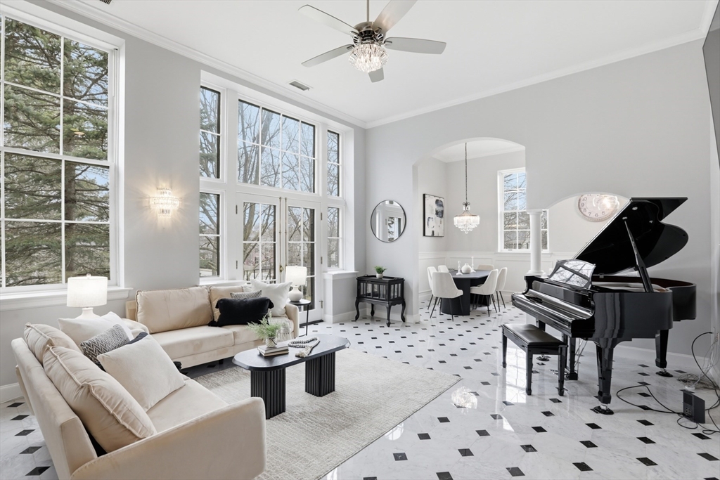 83 Church Street, Unit 15 Winchester, MA 01890 - Photo 2 of 34 a living room with furniture windows and a fireplace