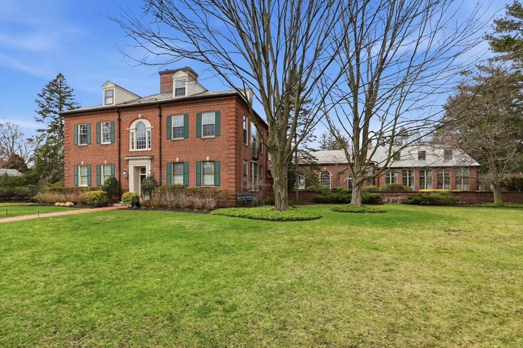 83 Church Street, Unit 15 Winchester, MA 01890 - Photo 33 of 34 a front view of a house with a garden