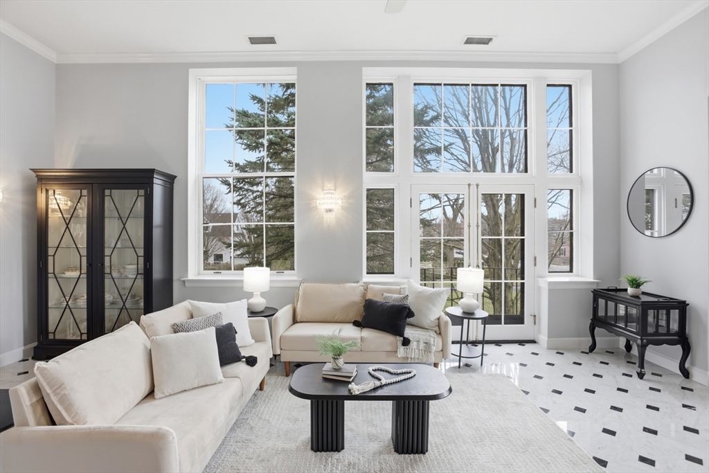 83 Church Street, Unit 15 Winchester, MA 01890 - Photo 6 of 34 a living room with furniture and a large window