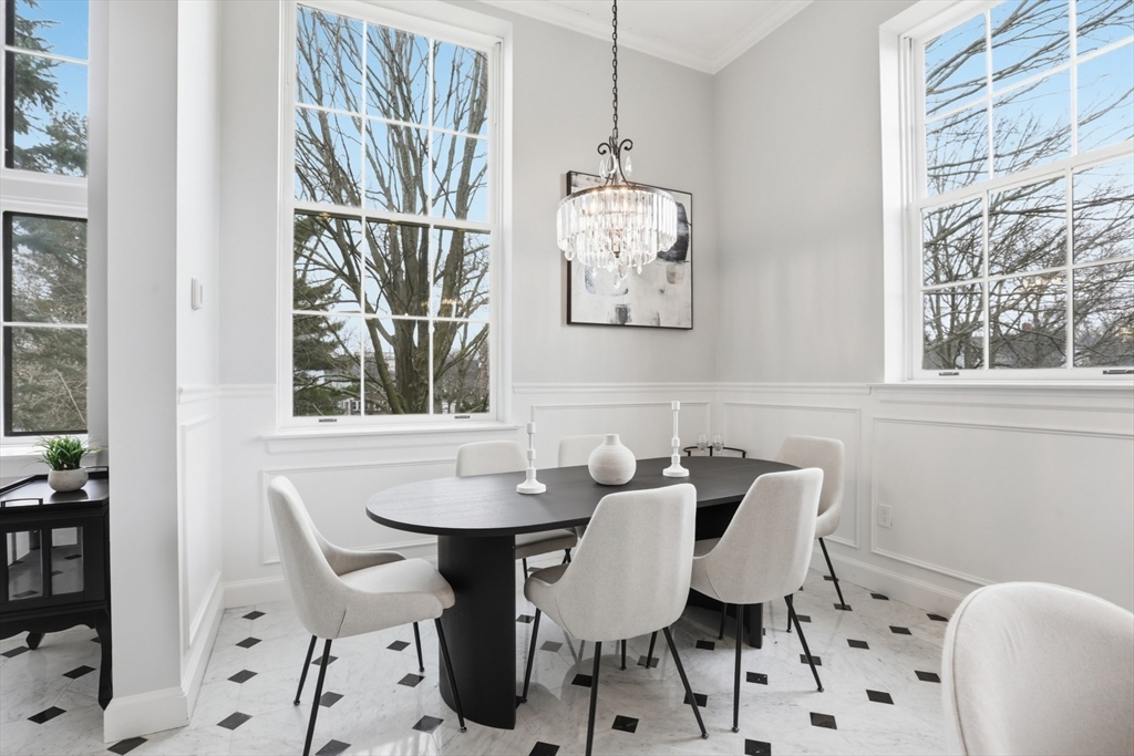 83 Church Street, Unit 15 Winchester, MA 01890 - Photo 9 of 34 a view of a dining room with furniture window and outside view
