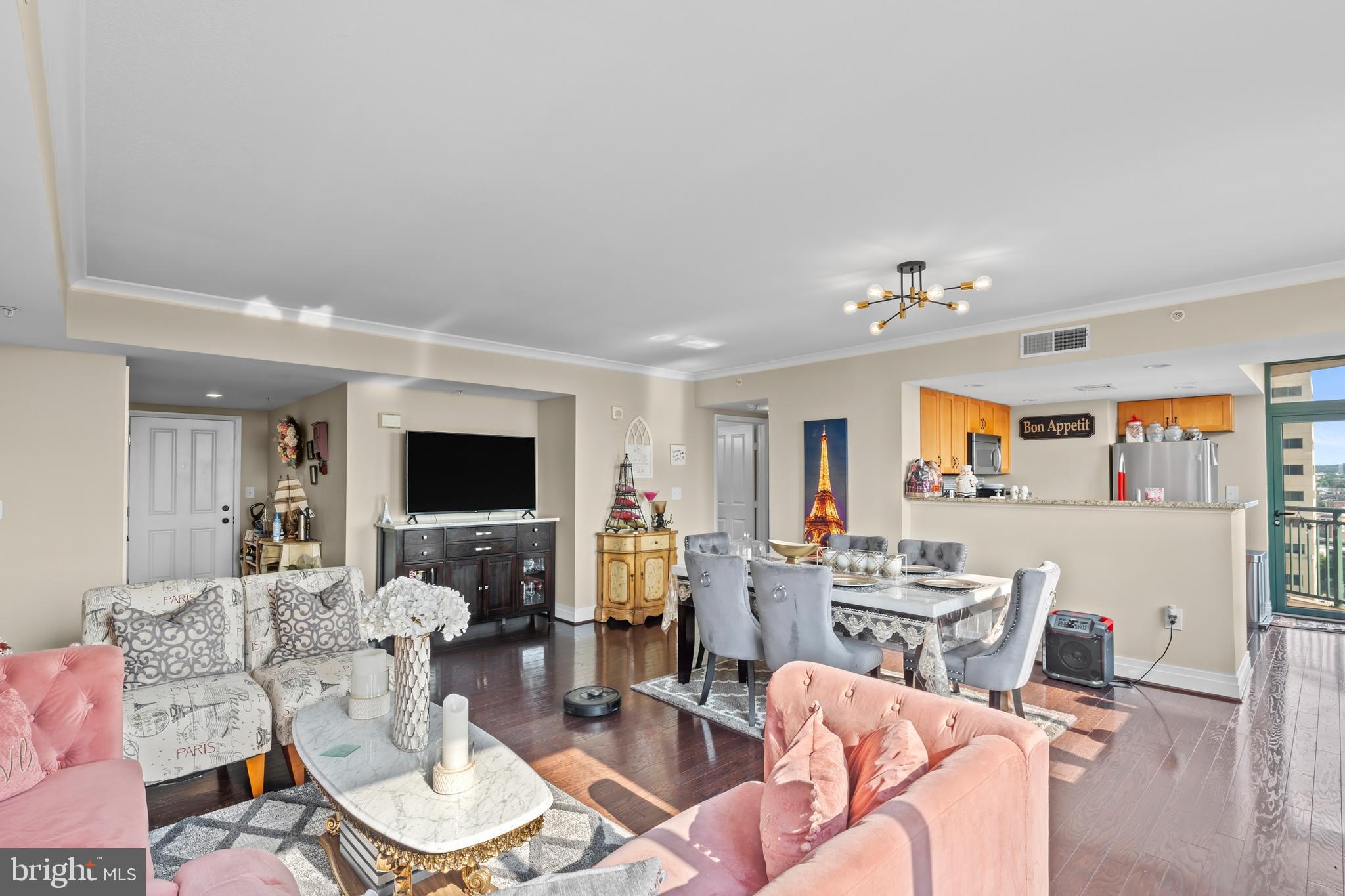 414 Water Street, Unit 1112 Baltimore, MD 21202 - Photo 16 of 40 a living room with furniture and a flat screen tv