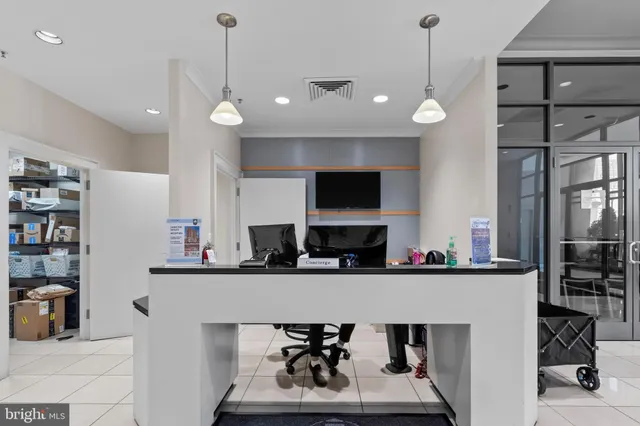 a kitchen with stainless steel appliances a sink refrigerator and microwave