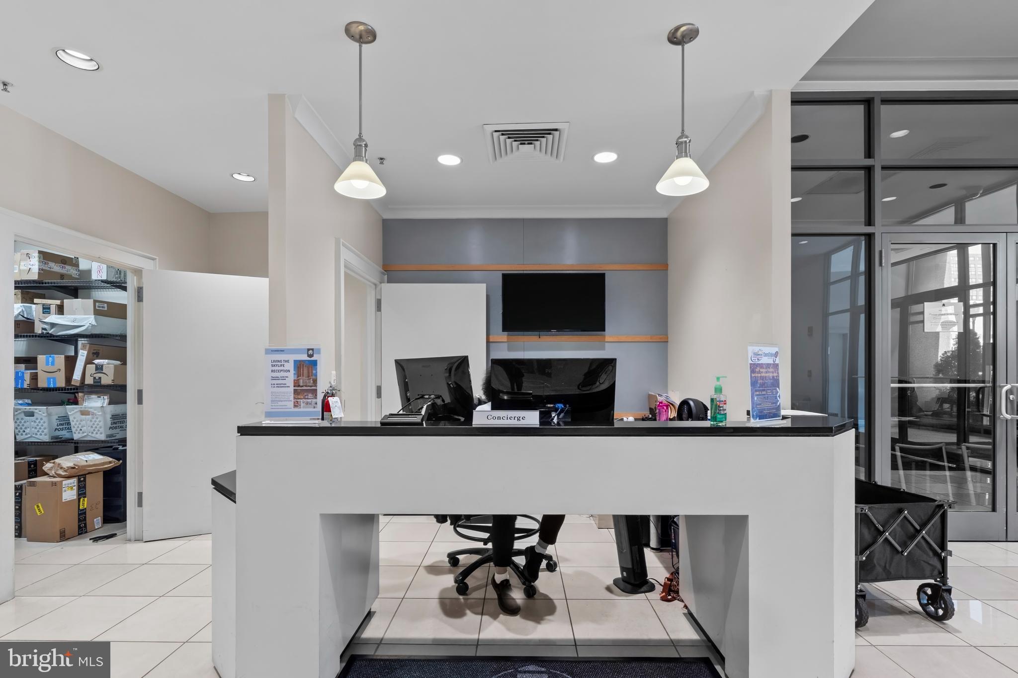 414 Water Street, Unit 1112 Baltimore, MD 21202 - Photo 3 of 40 a kitchen with stainless steel appliances a sink refrigerator and microwave