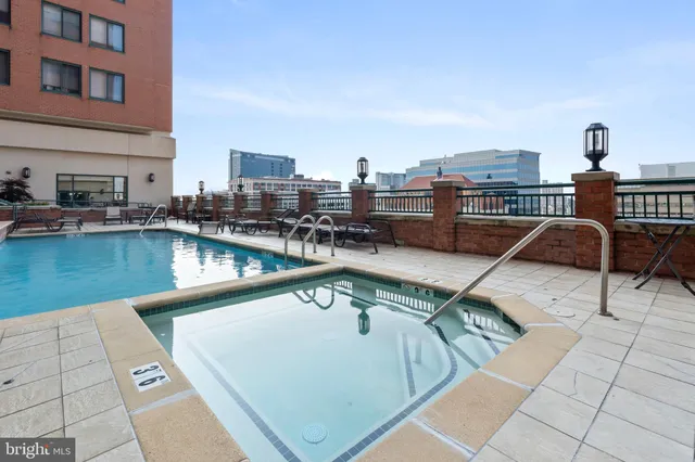 a view of a swimming pool with a lounge chair