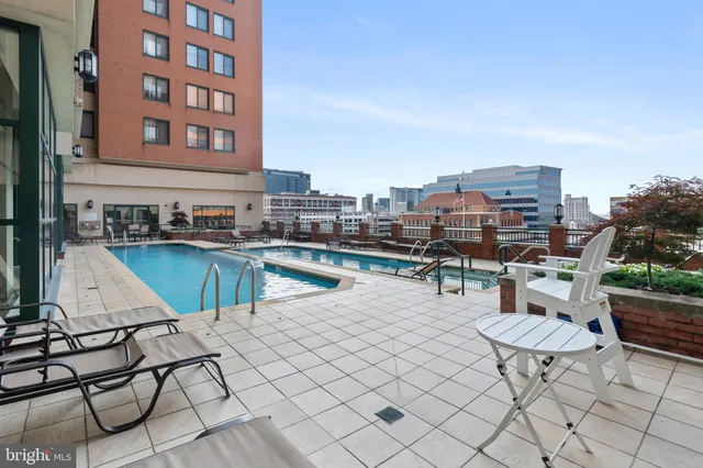a view of a chairs and table in patio