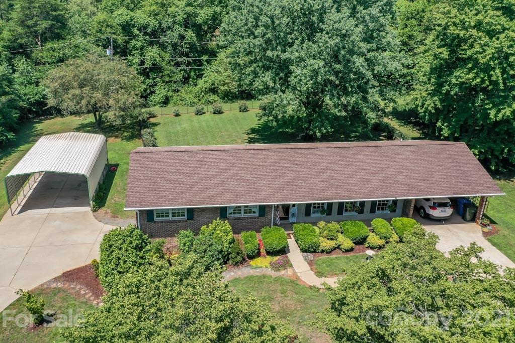 147 Ridgeland Drive Rutherfordton, NC 28139 - Photo 1 of 37 an aerial view of a house with a yard and potted plants