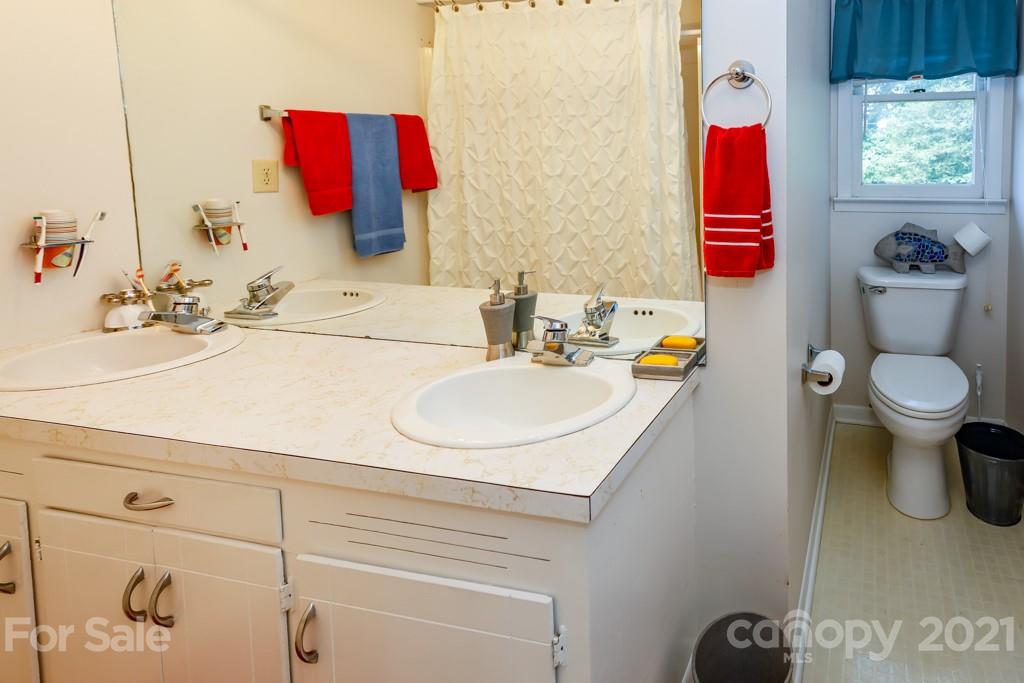 147 Ridgeland Drive Rutherfordton, NC 28139 - Photo 20 of 37 a bathroom with a sink vanity mirror and toilet