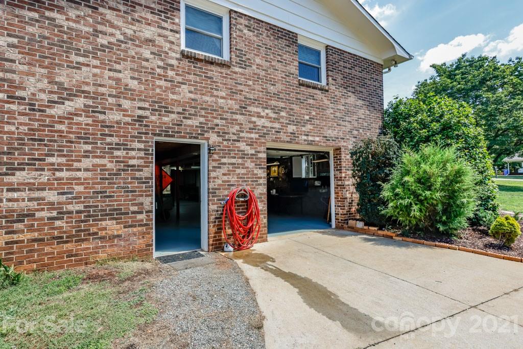 147 Ridgeland Drive Rutherfordton, NC 28139 - Photo 34 of 37 a view of a brick house with an outdoor space