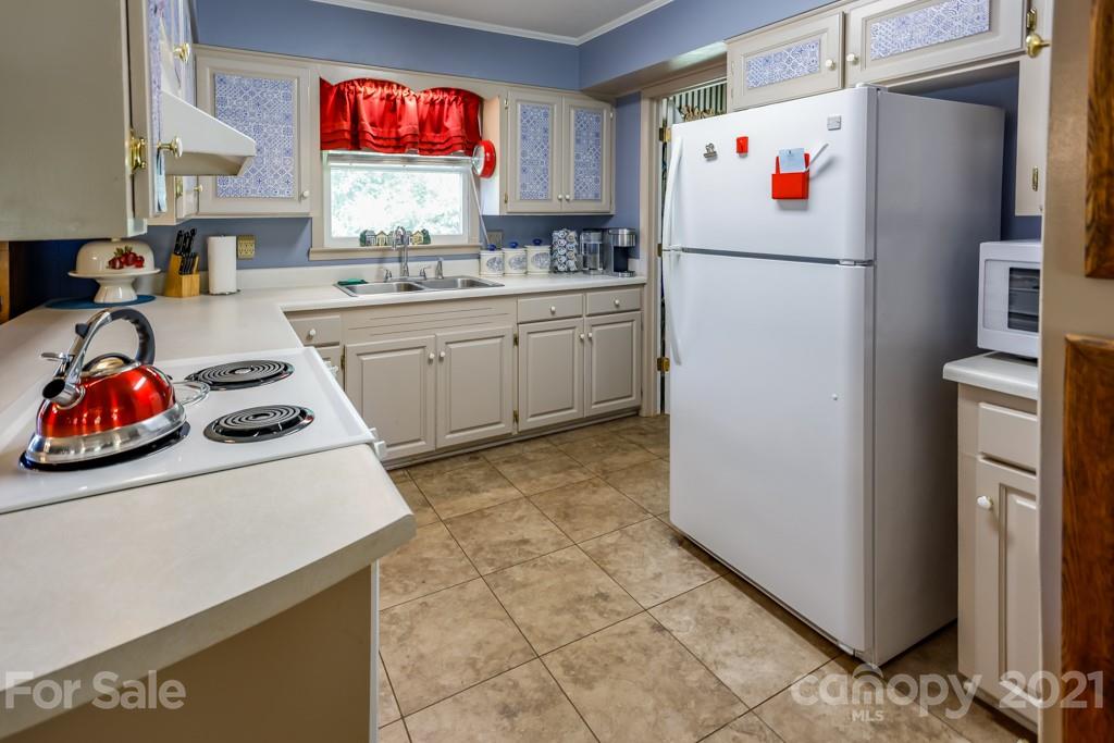 147 Ridgeland Drive Rutherfordton, NC 28139 - Photo 8 of 37 a white refrigerator freezer sitting inside of a kitchen