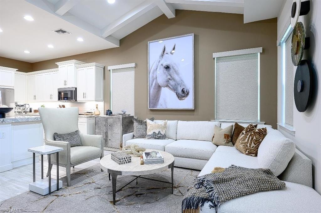 7164 Cayo Coco Lane Naples, FL 34113 - Photo 5 of 17 a living room with furniture and a flat screen tv