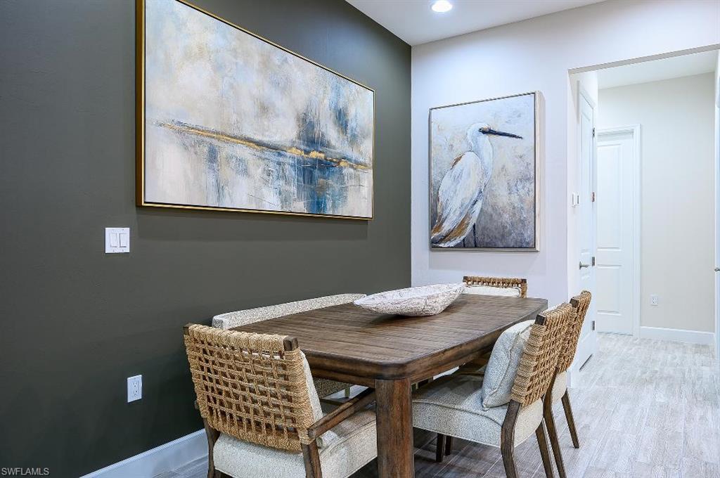 7164 Cayo Coco Lane Naples, FL 34113 - Photo 10 of 17 a view of a dining room with furniture