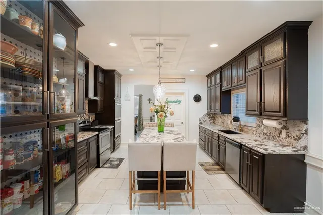 a kitchen with a stove refrigerator and cabinets
