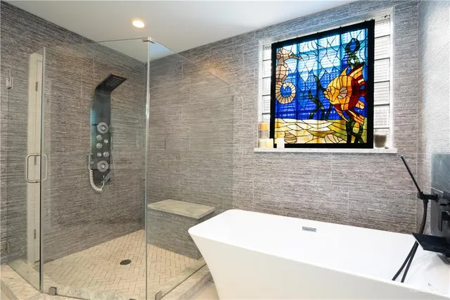 a bathroom with cabinets and mirror