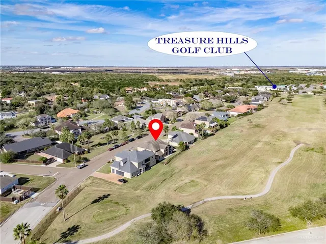 a large kitchen with stainless steel appliances kitchen island granite countertop a sink and cabinets