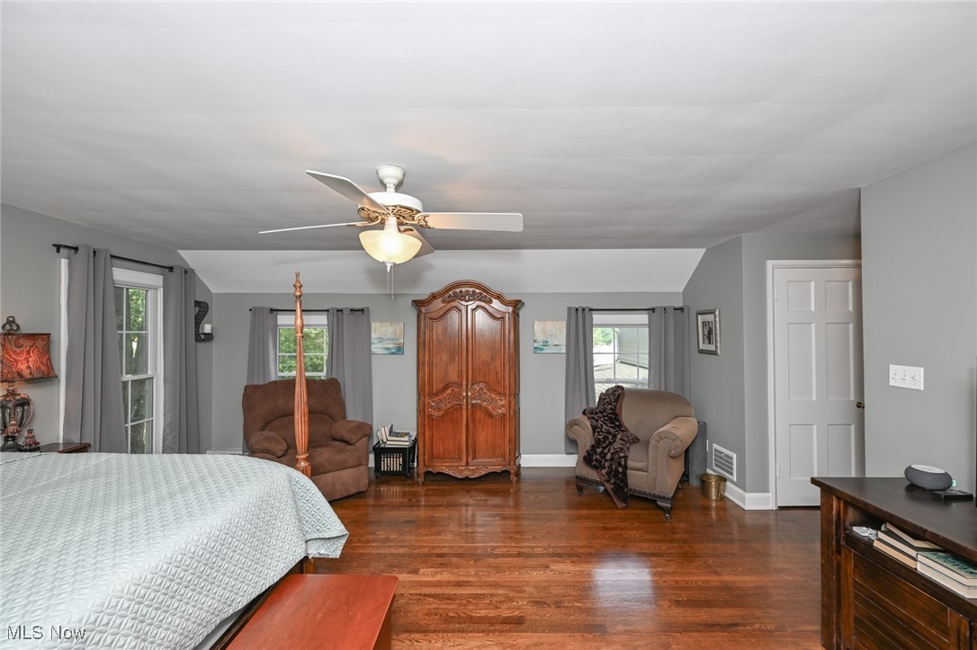 8960 Avery Road Broadview Heights, OH 44147 - Photo 26 of 50 Master Bedroom featuring multiple windows, dark wood-type flooring, and ceiling fan