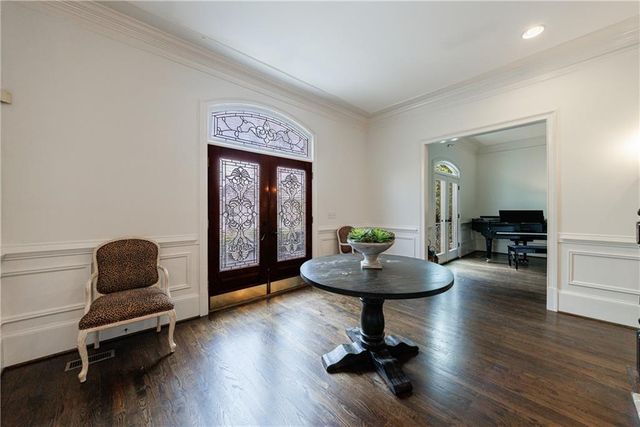 a living room with fireplace furniture and a flat screen tv