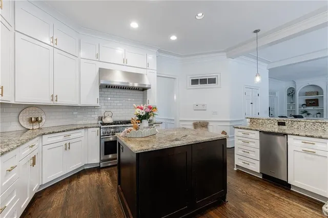 a living room with furniture a fireplace and a table