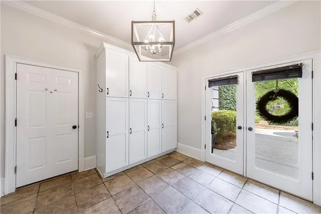 a view of a hallway with wooden floor and furniture