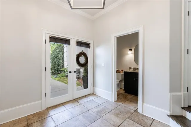 a living room with furniture a flat screen tv and a window