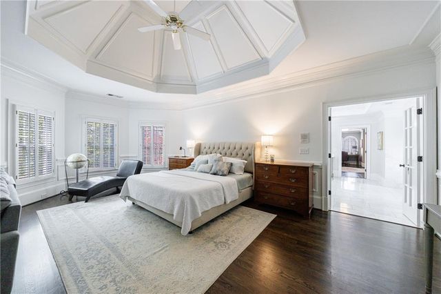 a view of a swimming pool with a patio and a garden