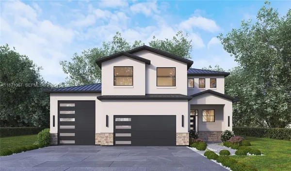 a front view of a house with a garden and yard