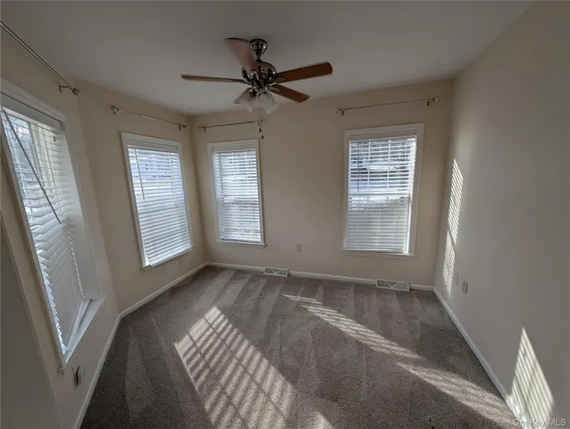 a view of room with window and hardwood floor