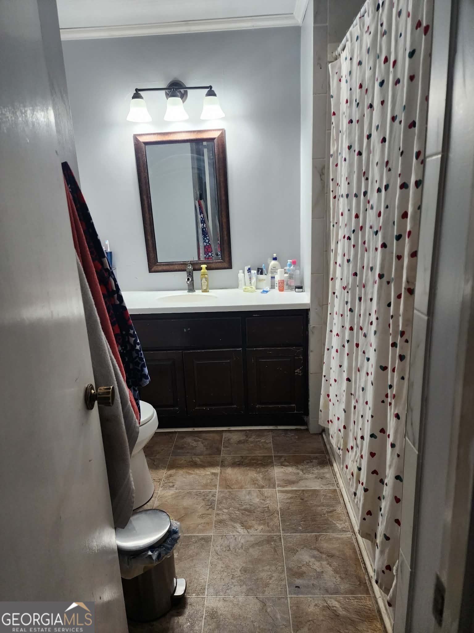 167 1st Avenue Cochran, GA 31014 - Photo 12 of 19 a bathroom with a sink and a mirror
