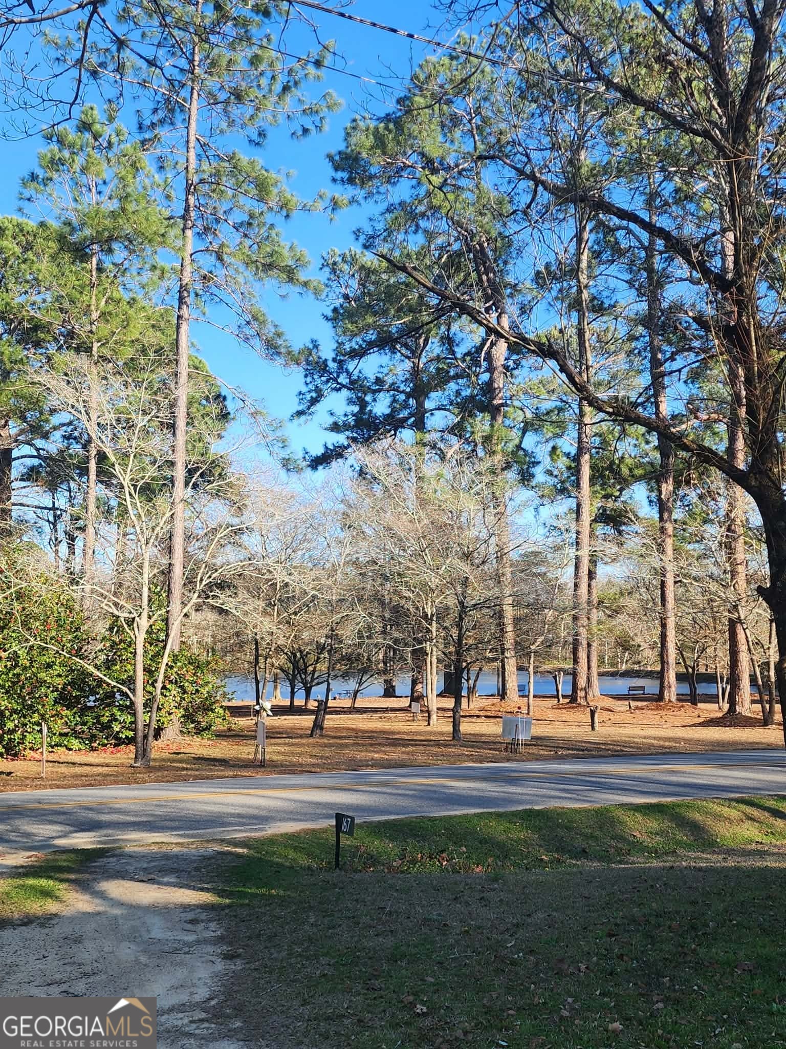 167 1st Avenue Cochran, GA 31014 - Photo 4 of 19 a building with trees in front of it