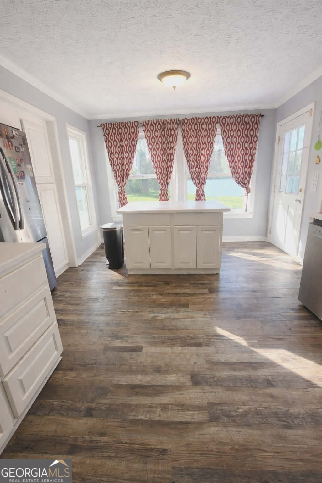 167 1st Avenue Cochran, GA 31014 - Photo 6 of 19 a view of entryway and hall with wooden floor