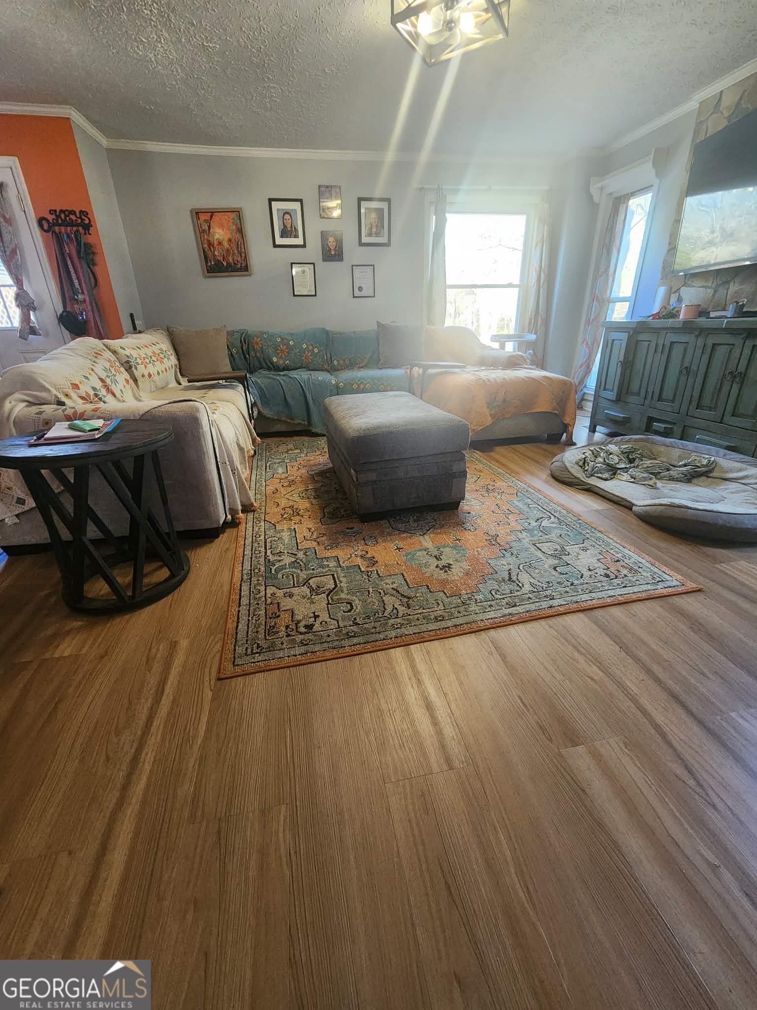 167 1st Avenue Cochran, GA 31014 - Photo 9 of 19 a bedroom with a bed and wooden floor