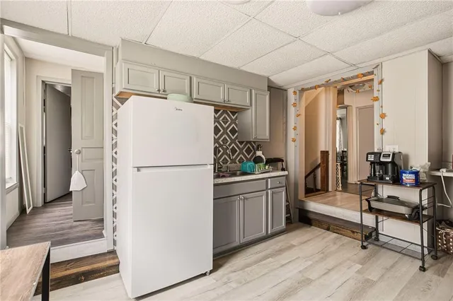a kitchen with a sink cabinets and window