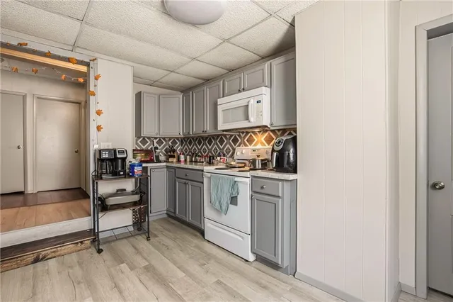 a bedroom that has a bed and a chair in it