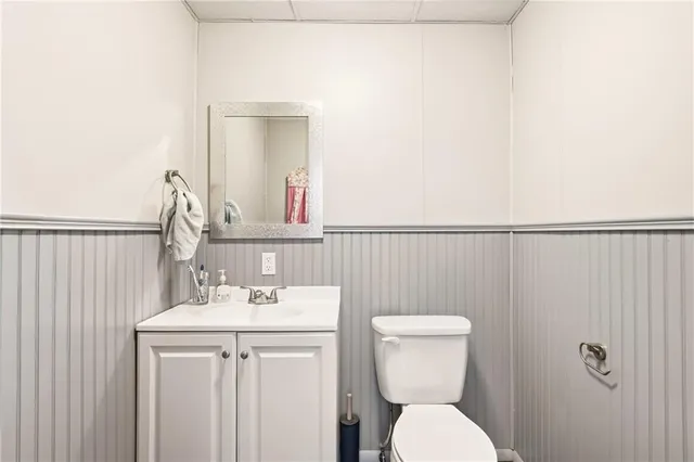 a bedroom with furniture and a flat screen tv