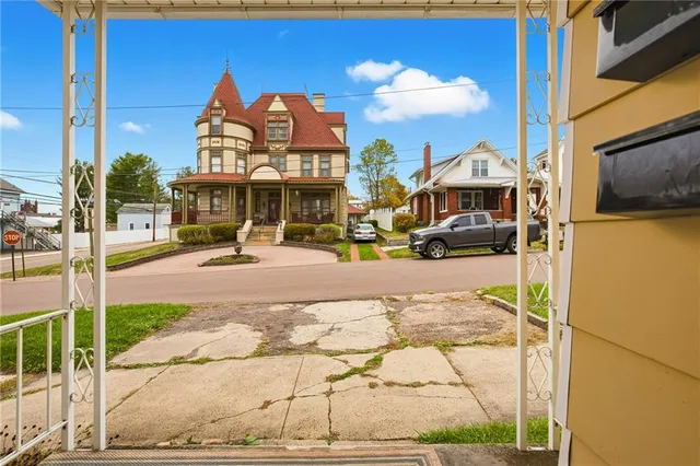 a view of a street with houses on both side