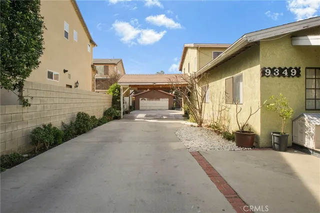 a view of a house with a street