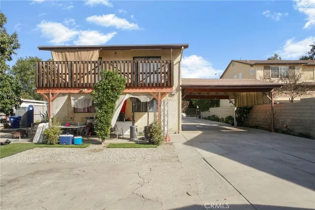 a view of a patio with a table and chairs