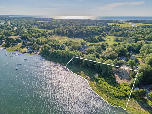 an aerial view of valley and lake