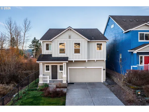 a front view of a house with yard