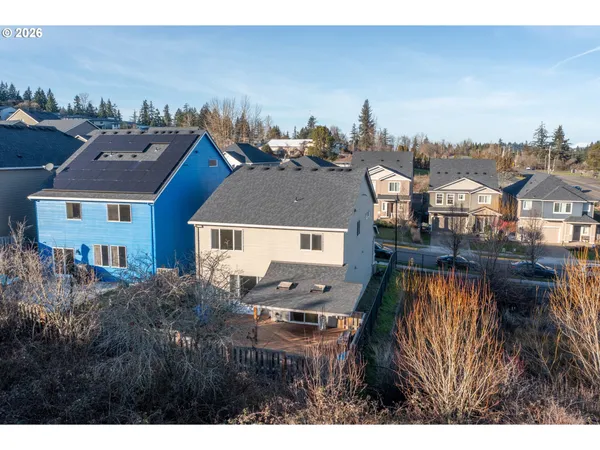 a view of a house with a yard and sitting space