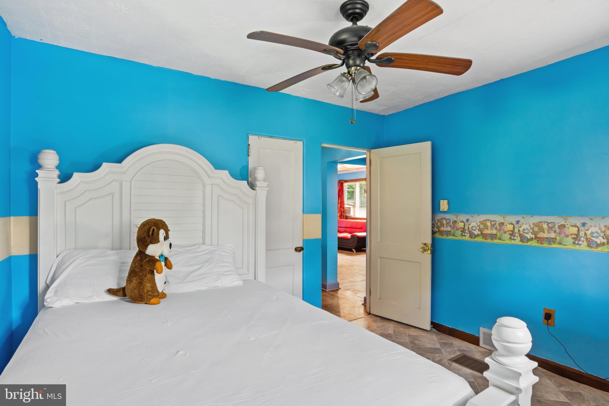 201 Village Road Harrisburg, PA 17112 - Photo 17 of 32 a bedroom with a bed and a chandelier