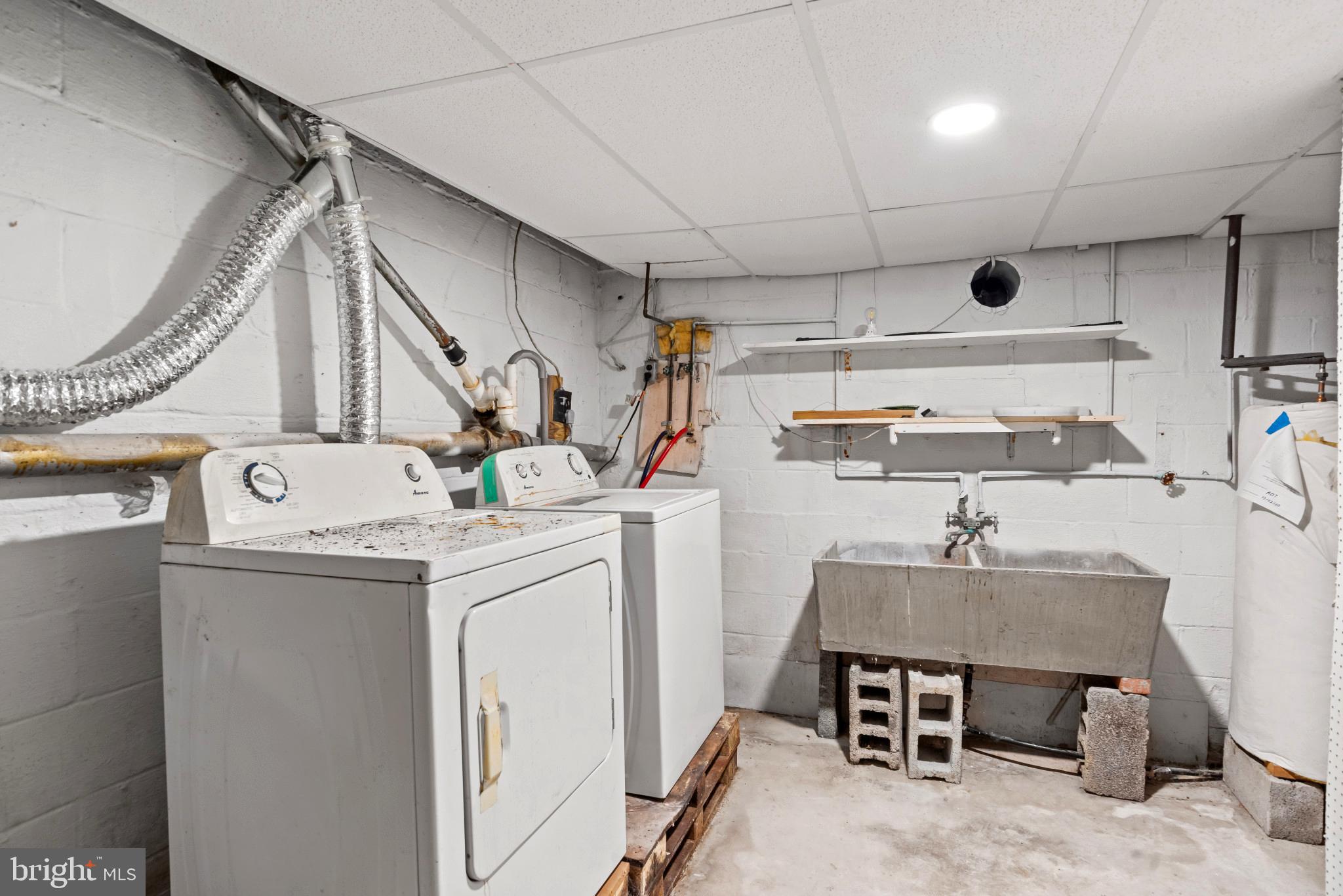 201 Village Road Harrisburg, PA 17112 - Photo 26 of 32 a storage room with cabinets washer and dryer