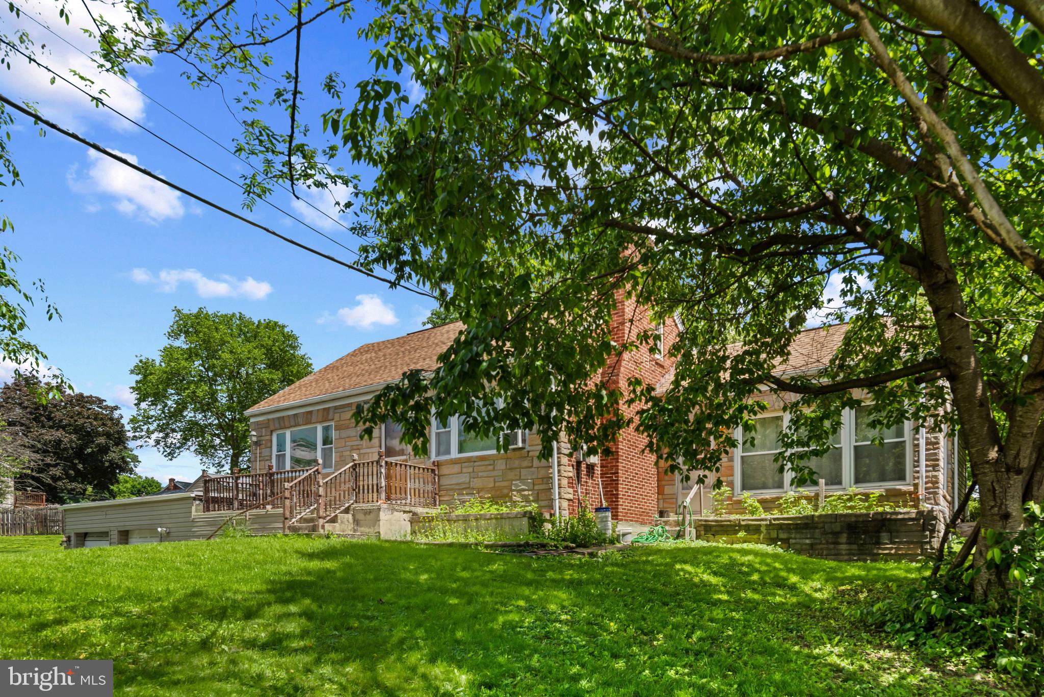 201 Village Road Harrisburg, PA 17112 - Photo 3 of 32 a view of a house with a yard