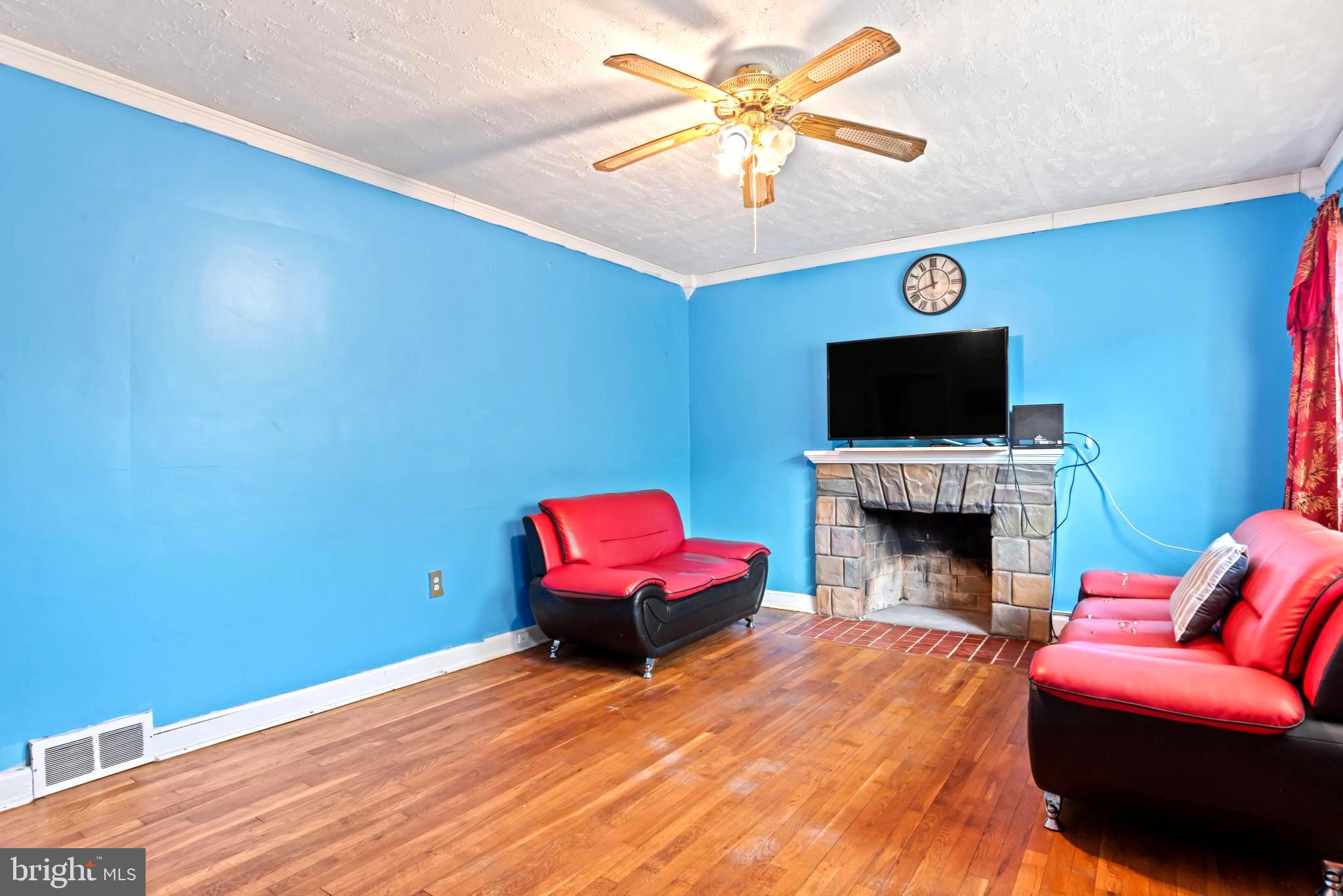 201 Village Road Harrisburg, PA 17112 - Photo 4 of 32 a bedroom with furniture and a fireplace