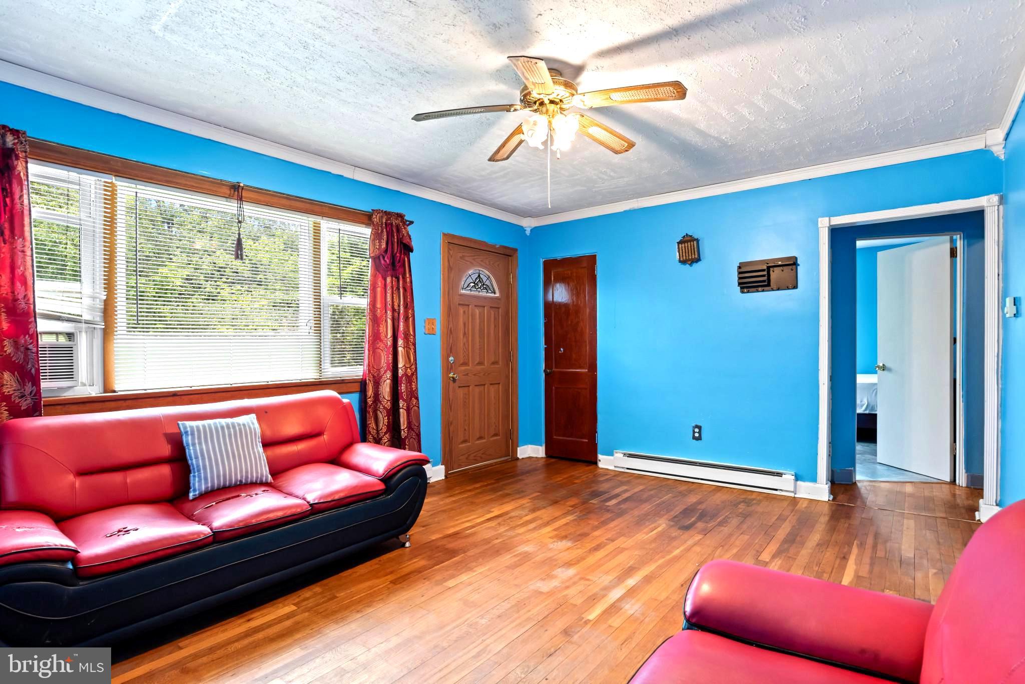 201 Village Road Harrisburg, PA 17112 - Photo 5 of 32 a living room with furniture and a large window