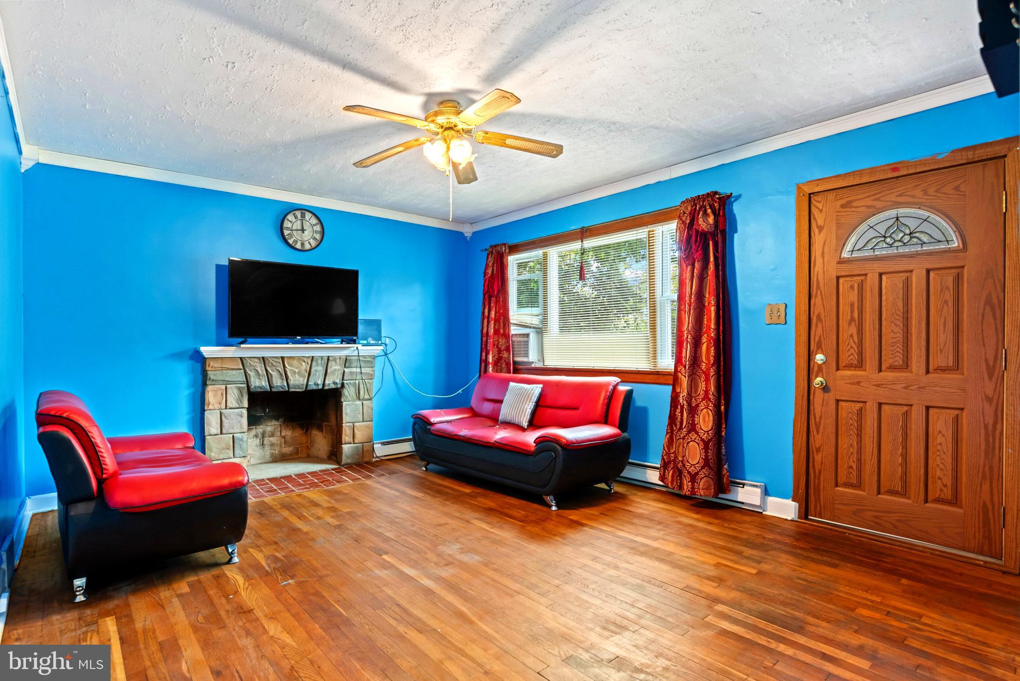 201 Village Road Harrisburg, PA 17112 - Photo 7 of 32 a living room with furniture fireplace and flat screen tv