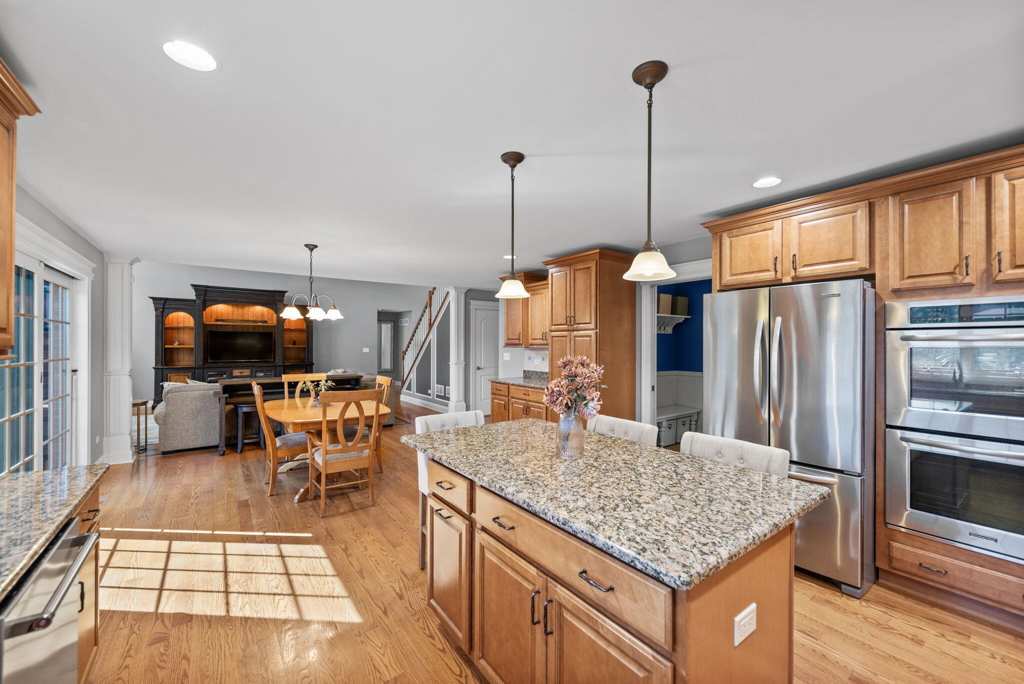 10135 S Branch St. John, IN 46373 - Photo 15 of 45 a kitchen with stainless steel appliances granite countertop sink stove and refrigerator