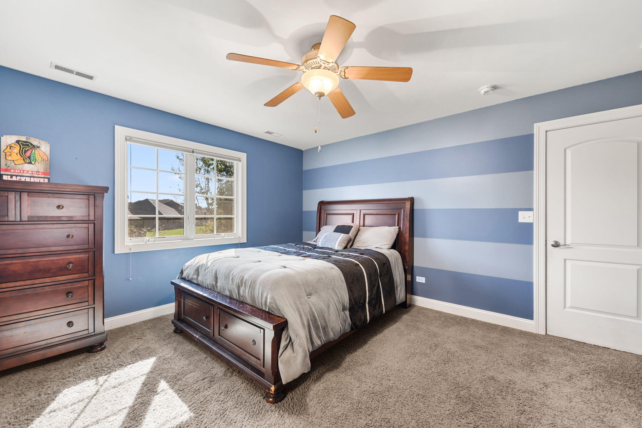 10135 S Branch St. John, IN 46373 - Photo 24 of 45 a bed sitting in a spacious bedroom next to a window
