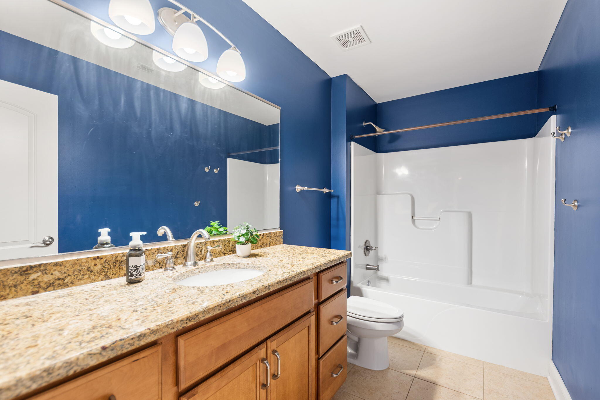 10135 S Branch St. John, IN 46373 - Photo 27 of 45 a bathroom with a granite countertop sink toilet and shower