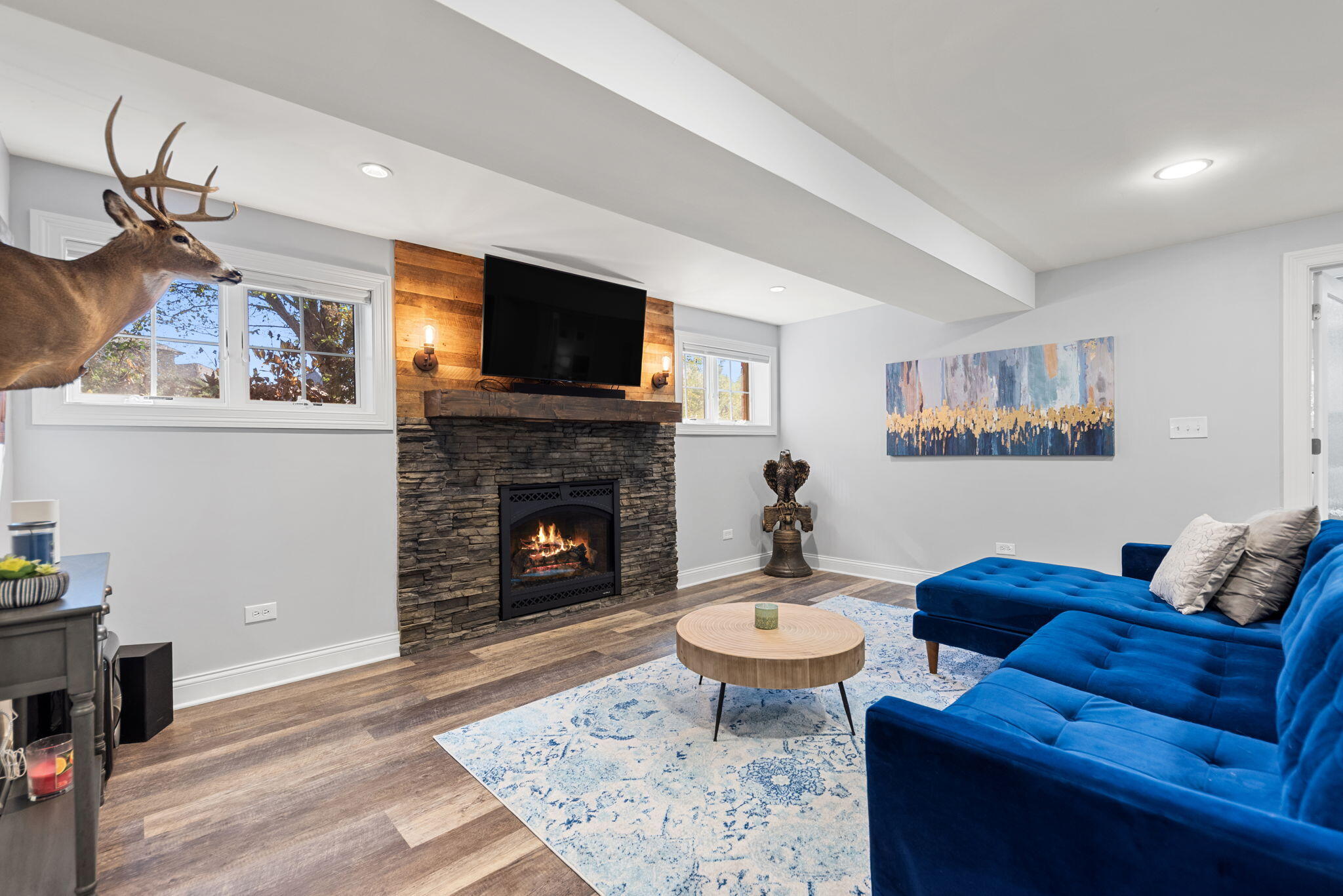10135 S Branch St. John, IN 46373 - Photo 29 of 45 a living room with furniture a flat screen tv and a fireplace